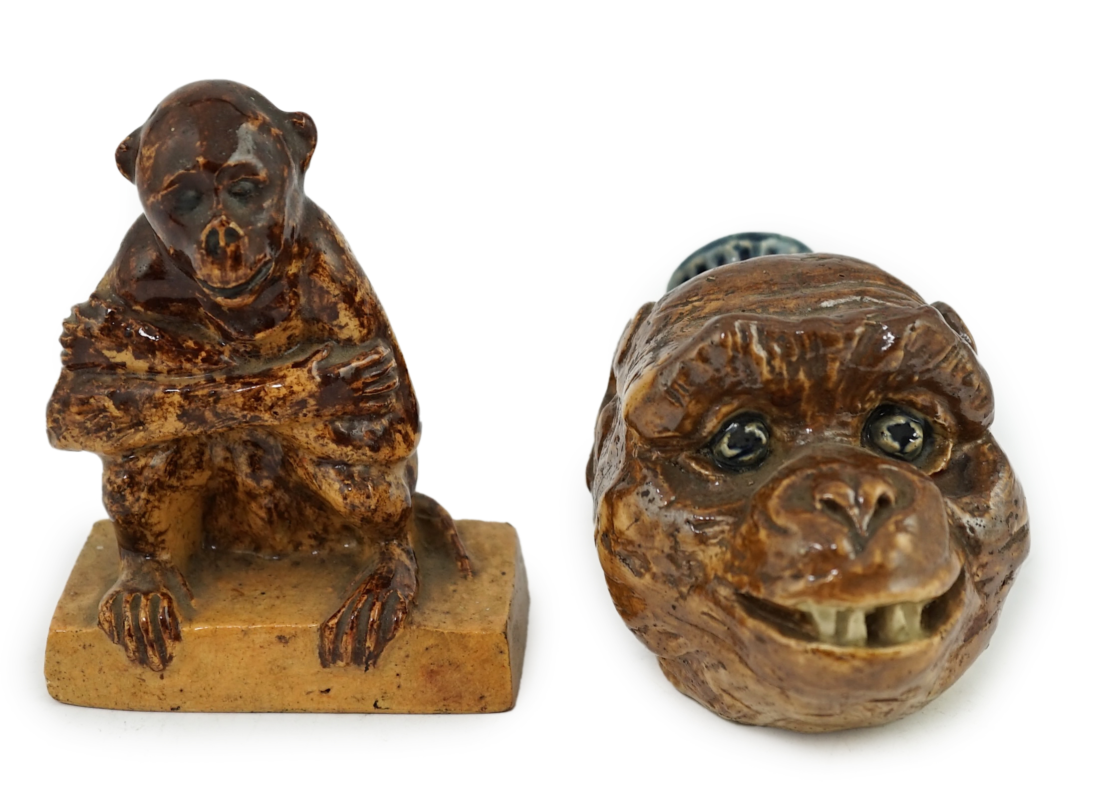 A Clapham Common pottery figure of a seated monkey by J. Frisby Jordan, c.1925, and a stoneware monkey head flask, by JP